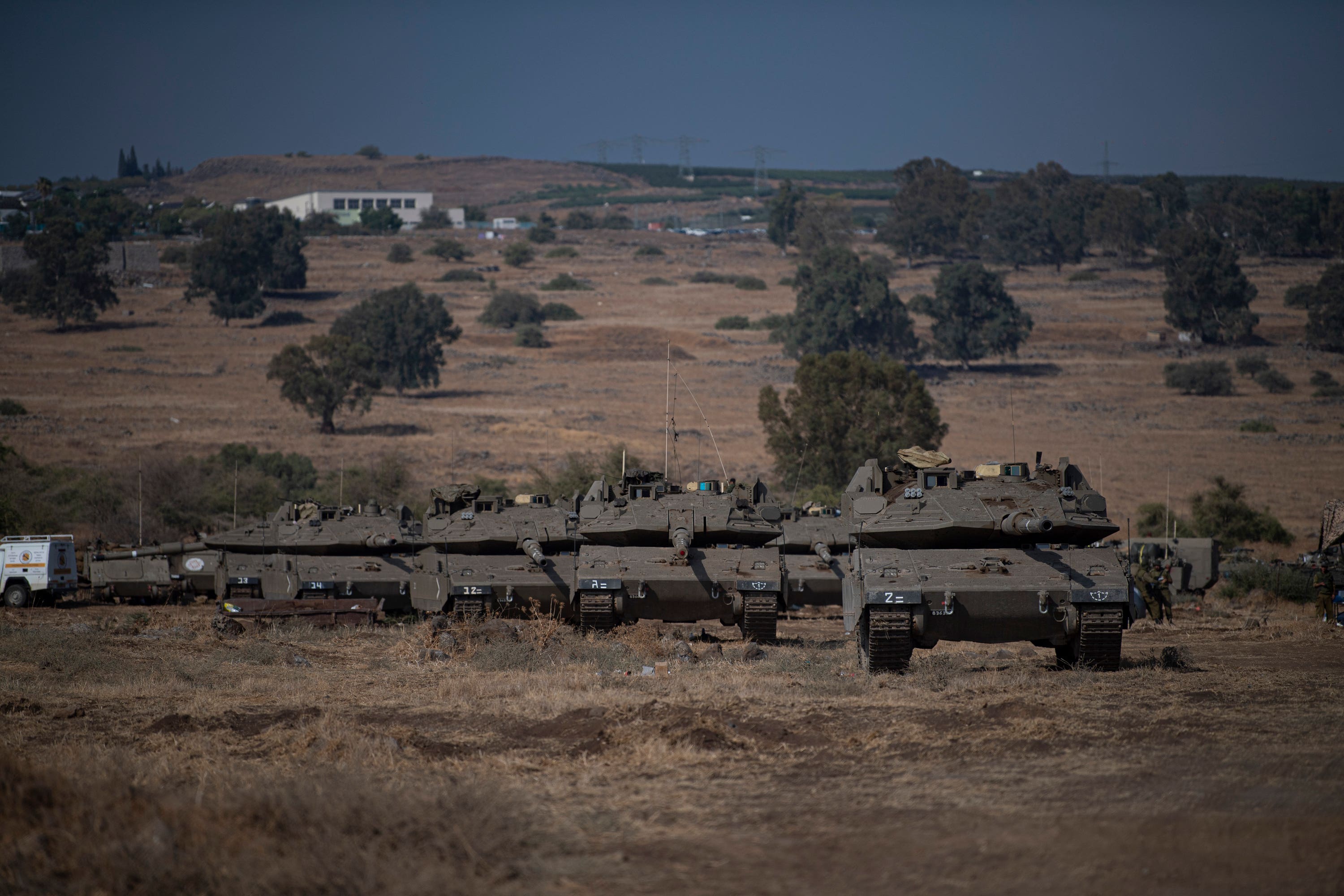 Israeli tanks were seen near the border with Lebanon on Tuesday (Gil Eliyahu/AP) 