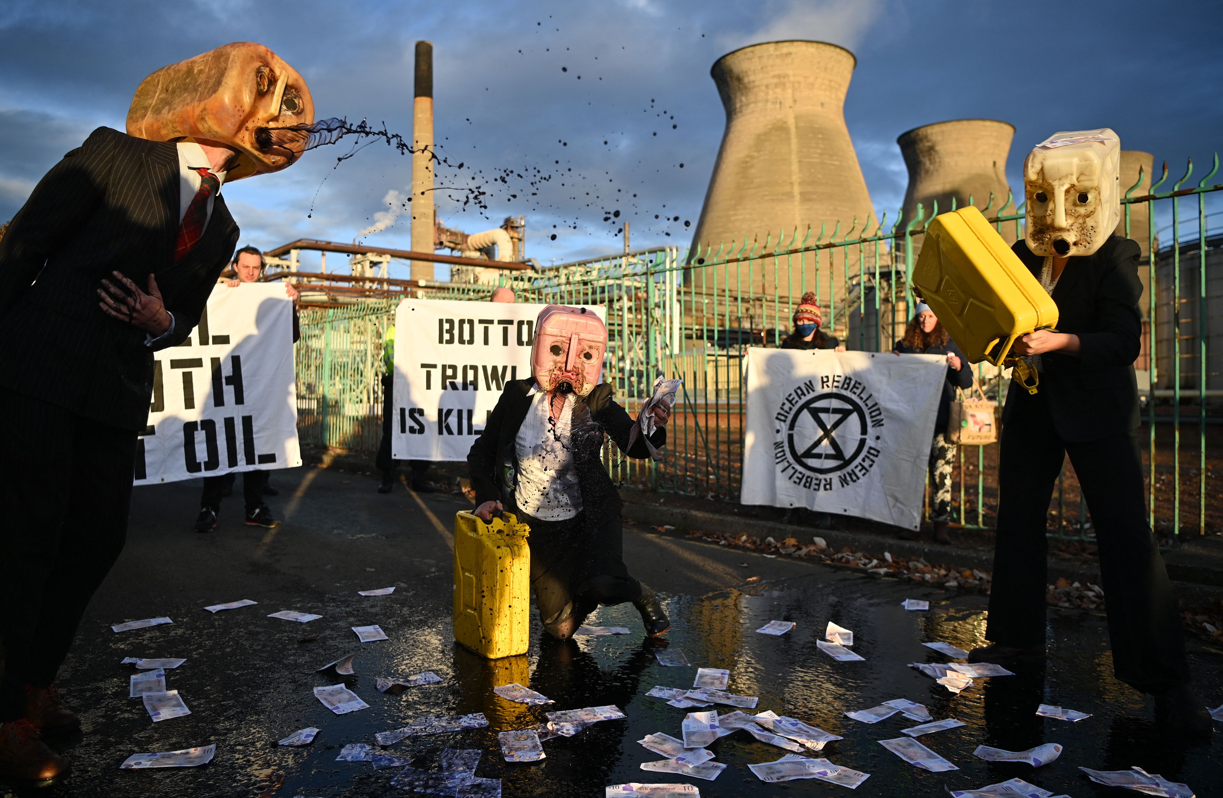 Oil Heads, climate activists from the Ocean Rebellion group, demonstrate outside the INEOS intergrated refinery and petrochemicals centre plant in Grangemouth.