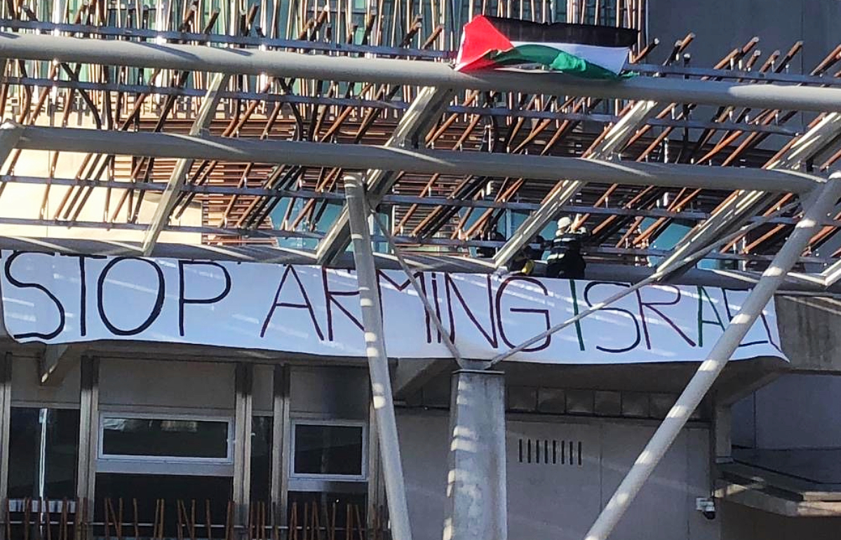 Pro-Palestinian protesters climb the Scottish Parliament building on November 9, 2023.
