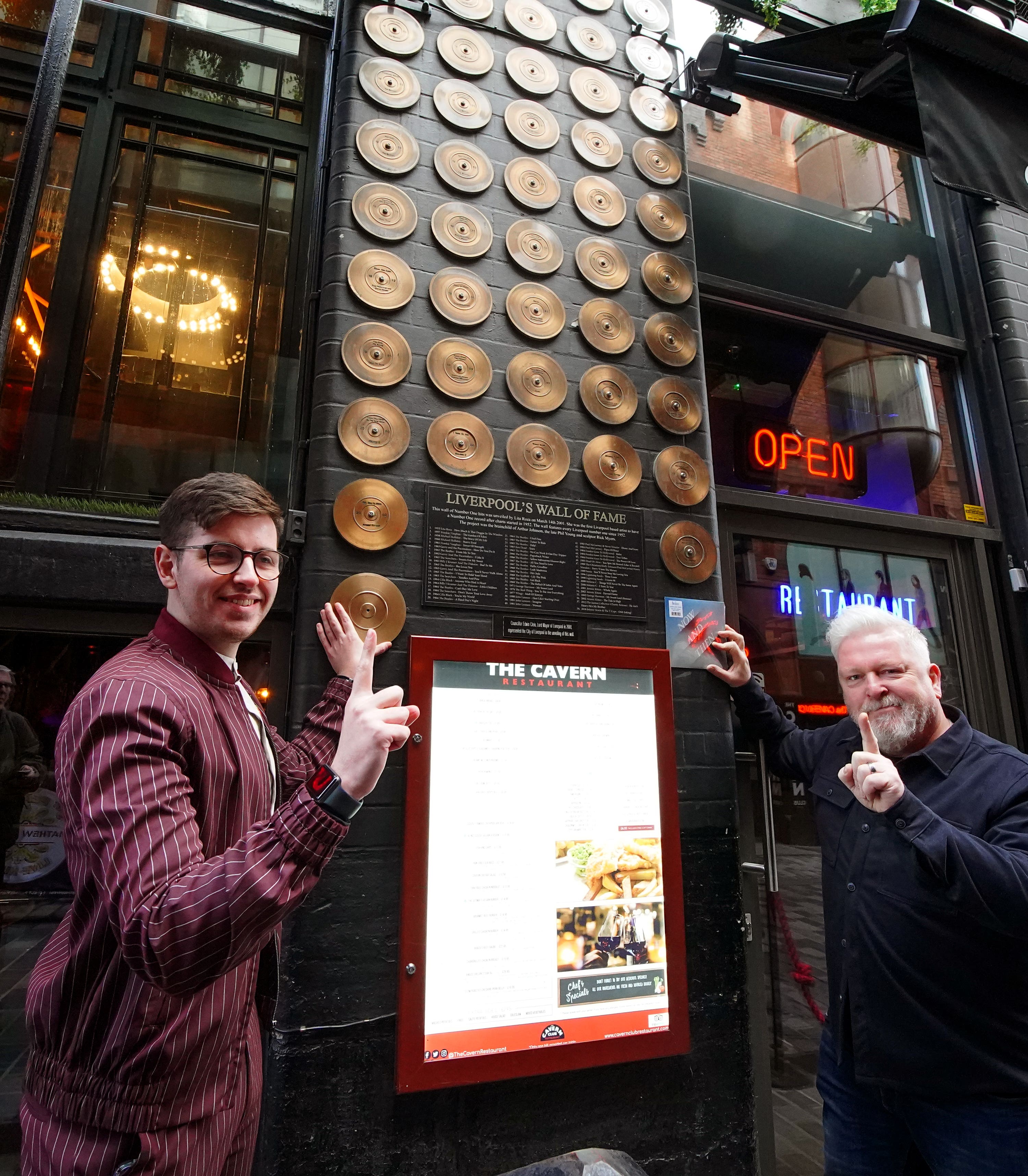 Liverpool’s cabinet member for culture, Cllr Harry Doyle (left) with Jon Keats, director of The Cavern, at Liverpool’s Pop Music Wall of Fame for the announcement that the new Beatles single, Now And Then, is to be immortalised on the wall.