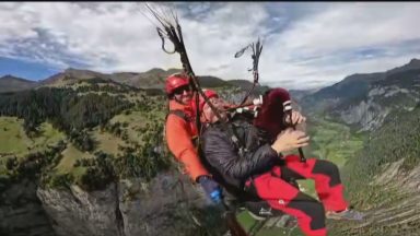 Edinburgh bagpiper performs while paragliding in the Alps