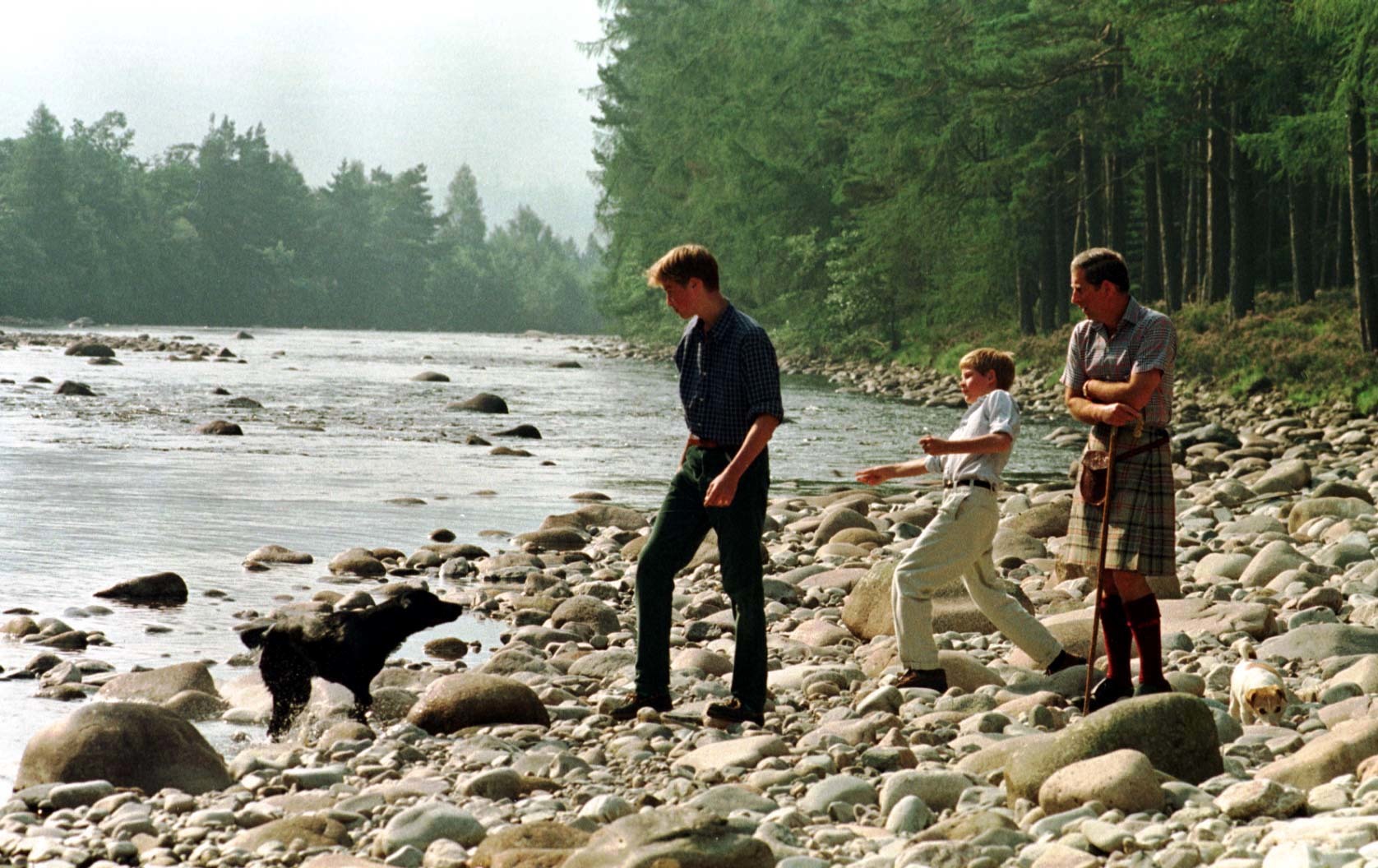 The Prince of Wales and his sons Prince William, 15, and Harry, 12, take an early morning walk along the banks of the River Dee on the Balmoral Estate today (Tuesday).Photo Chris Bacon/PA. See PA Story ROYAL Charles