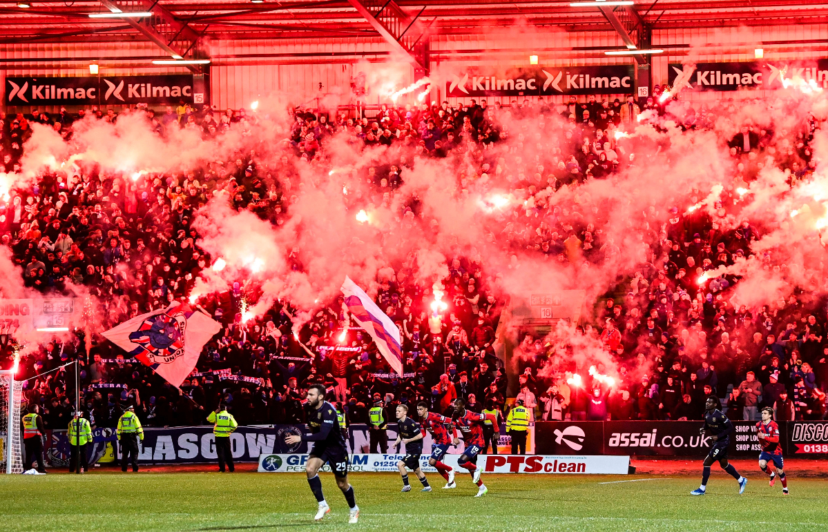 DUNDEE, SCOTLAND - NOVEMBER 01: Rangers fans light up the Bob Shankly stand with pyro during a cinch Premiership match between Dundee FC and Rangers at The Scot Foam Stadium at Dens Park, on November 01, 2023, in Dundee, Scotland.  (Photo by Rob Casey / SNS Group) 