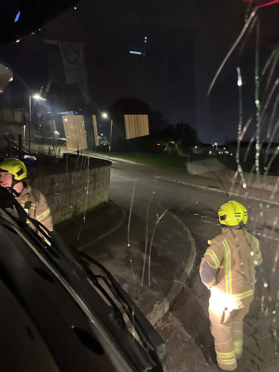 A brick smashed the window of a fire service appliance.