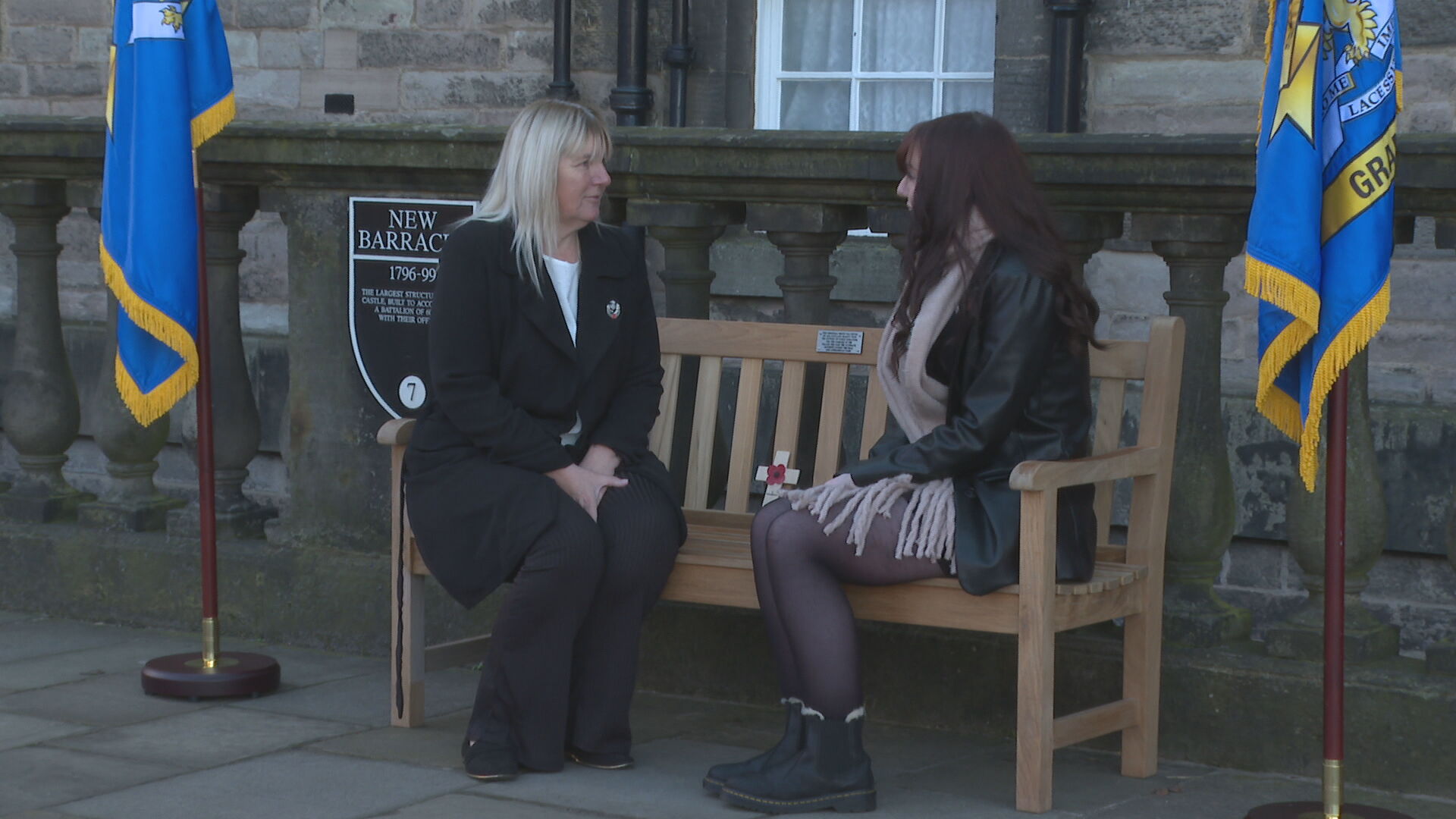 Shona Mathews (left) sitting with her daughter, Meghan, on the memorial bench. 