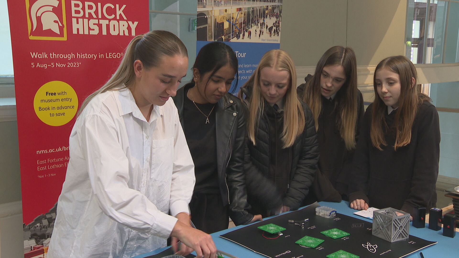 Zoe Clark (left), from Spire Global, teaching pupils how to build a satellite. 