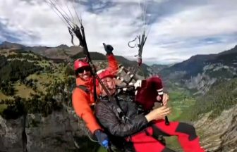 Paragliding Edinburgh bagpiper takes tunes to new heights as he plays over the Swiss Alps