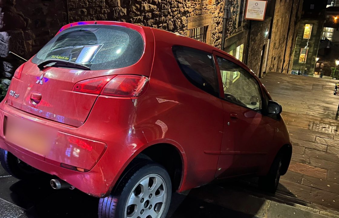 Car gets stuck after crashing down Edinburgh Castle steps