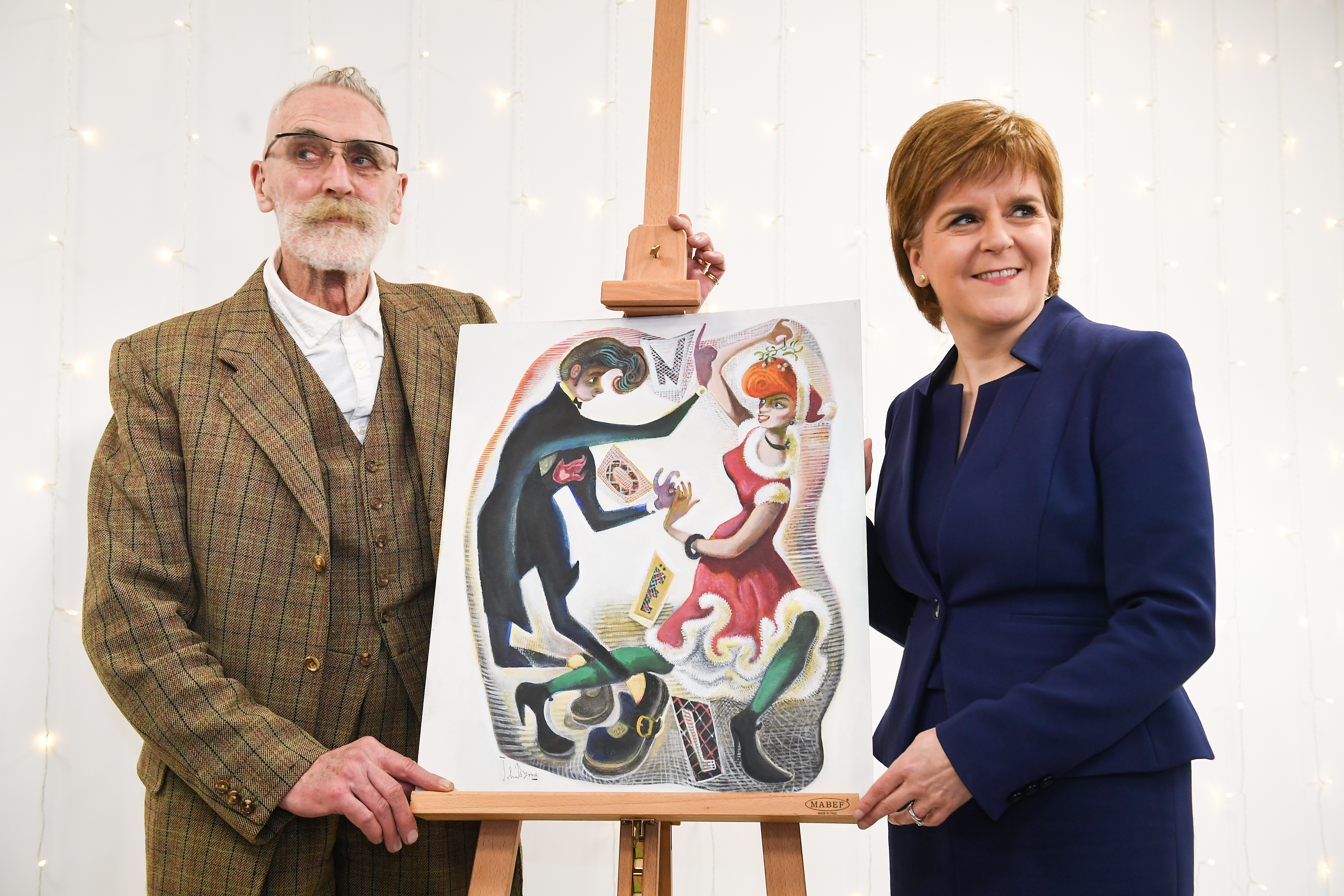 First Minister Nicola Sturgeon and John Byrne unveil the artwork for her official 2017 Christmas Card at St Margaret's House on December 5, 2017.