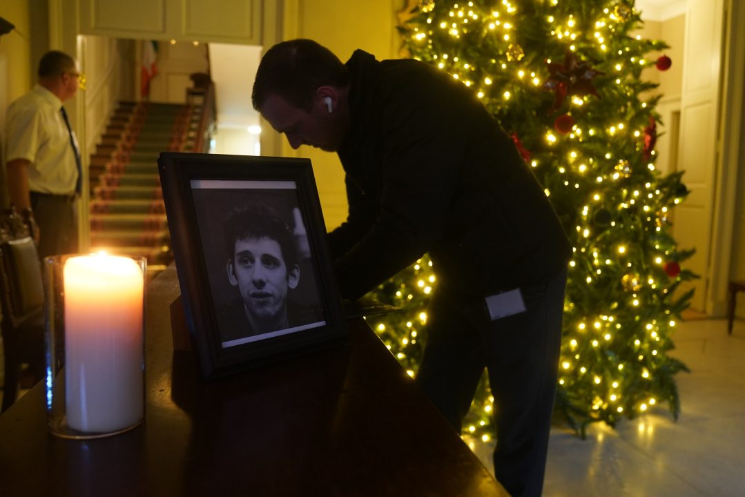 A candle burns next to a photograph of The Pogues frontman Shane MacGowan at the Mansion House, in Dublin