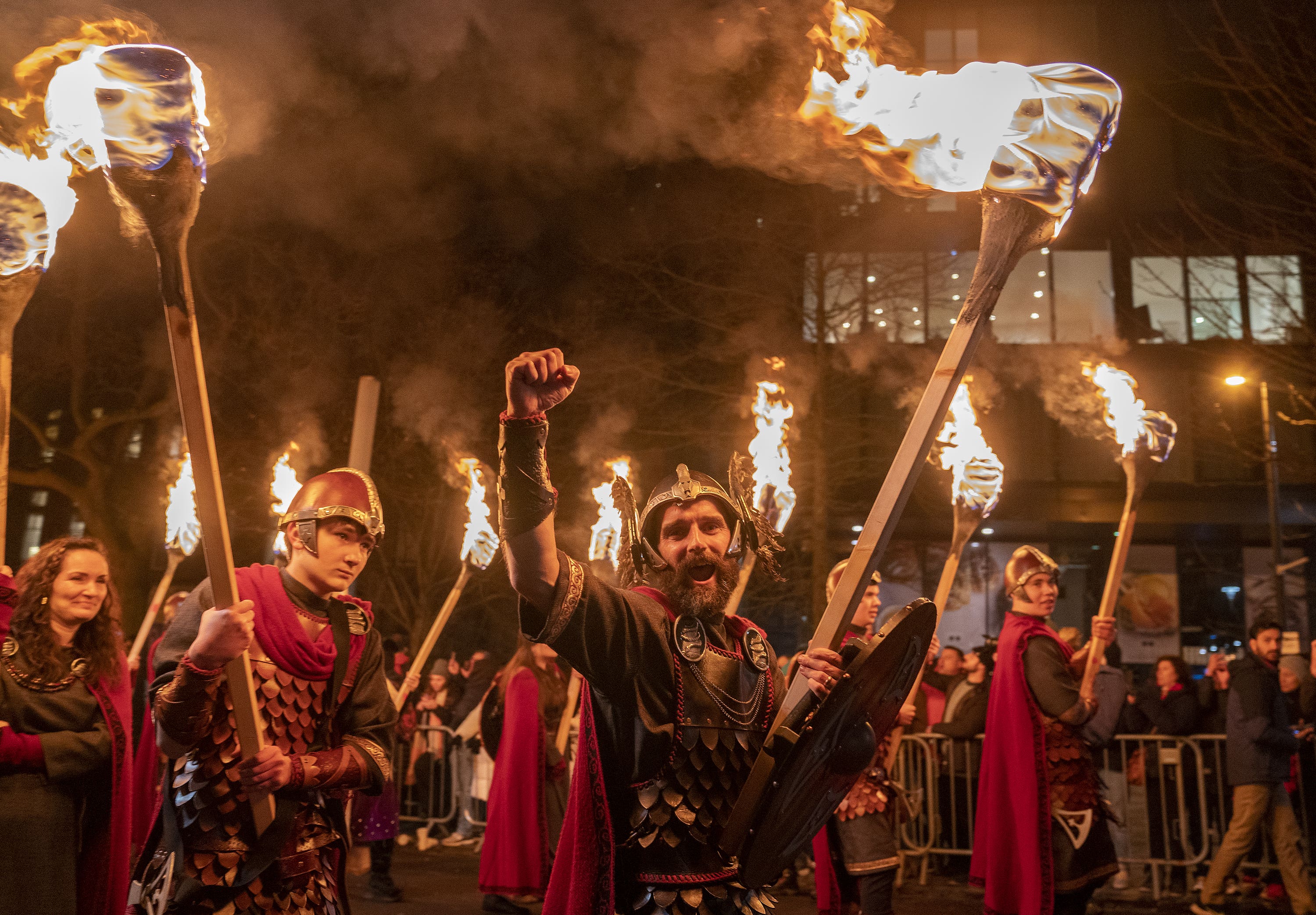 Vikings from the Shetland South Mainland Up Helly Aa Jarl Squad lead the torchlight procession through Edinburgh city centre (Jane Barlow/PA).