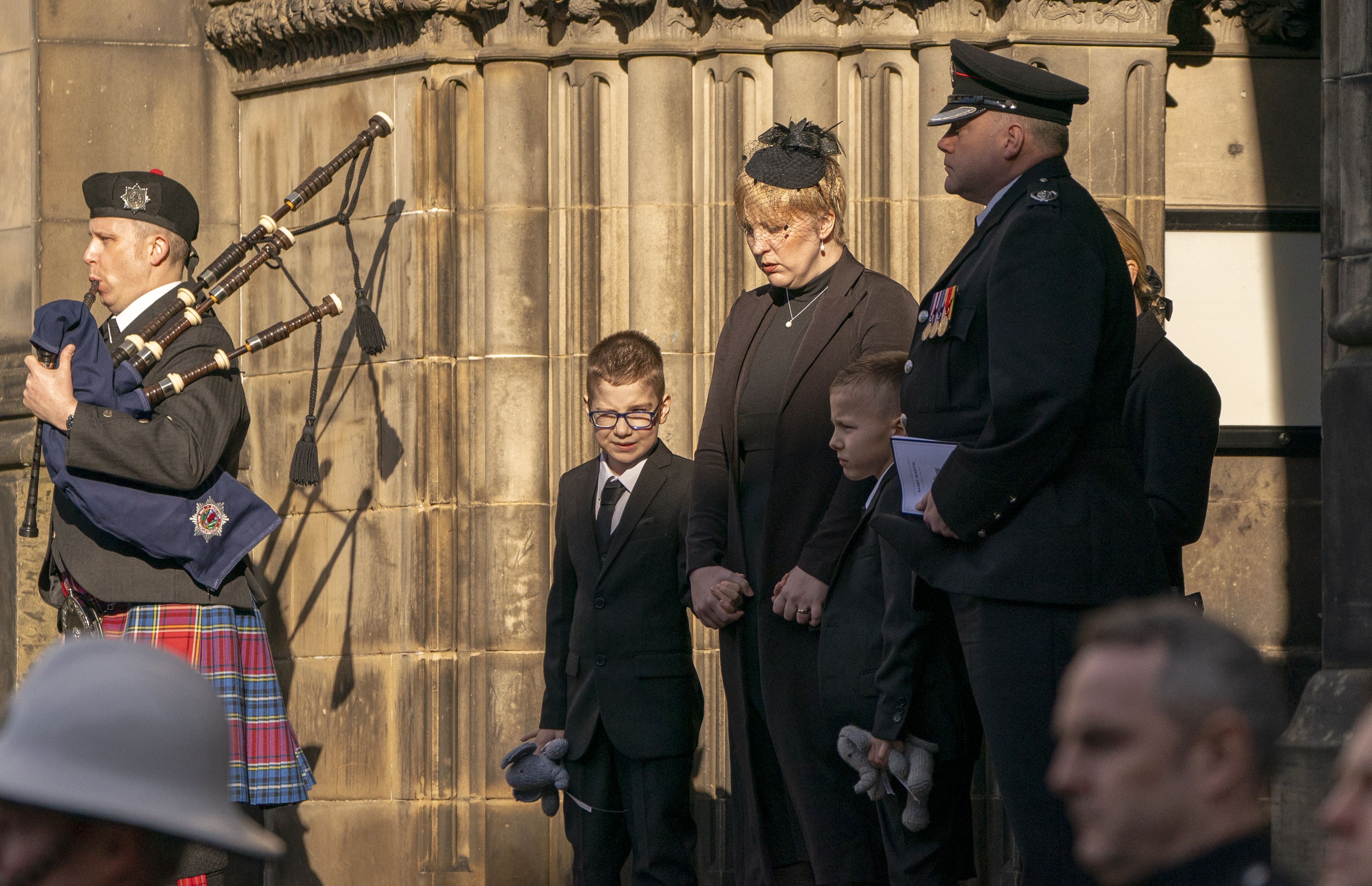 Shelley Martin, widow of Barry Martin, with their twin sons Oliver and Daniel at his funeral in Edinburgh