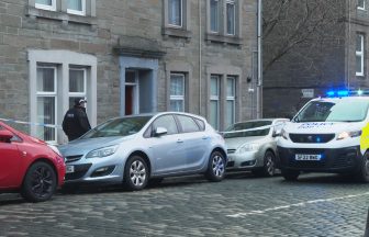 Three charged after death of man who fell from Dundee flat window