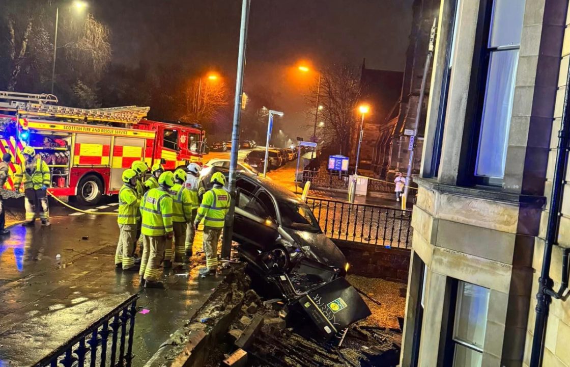 Fire crews lock down road after car crashes through barrier into flat in Pollokshields, Glasgow