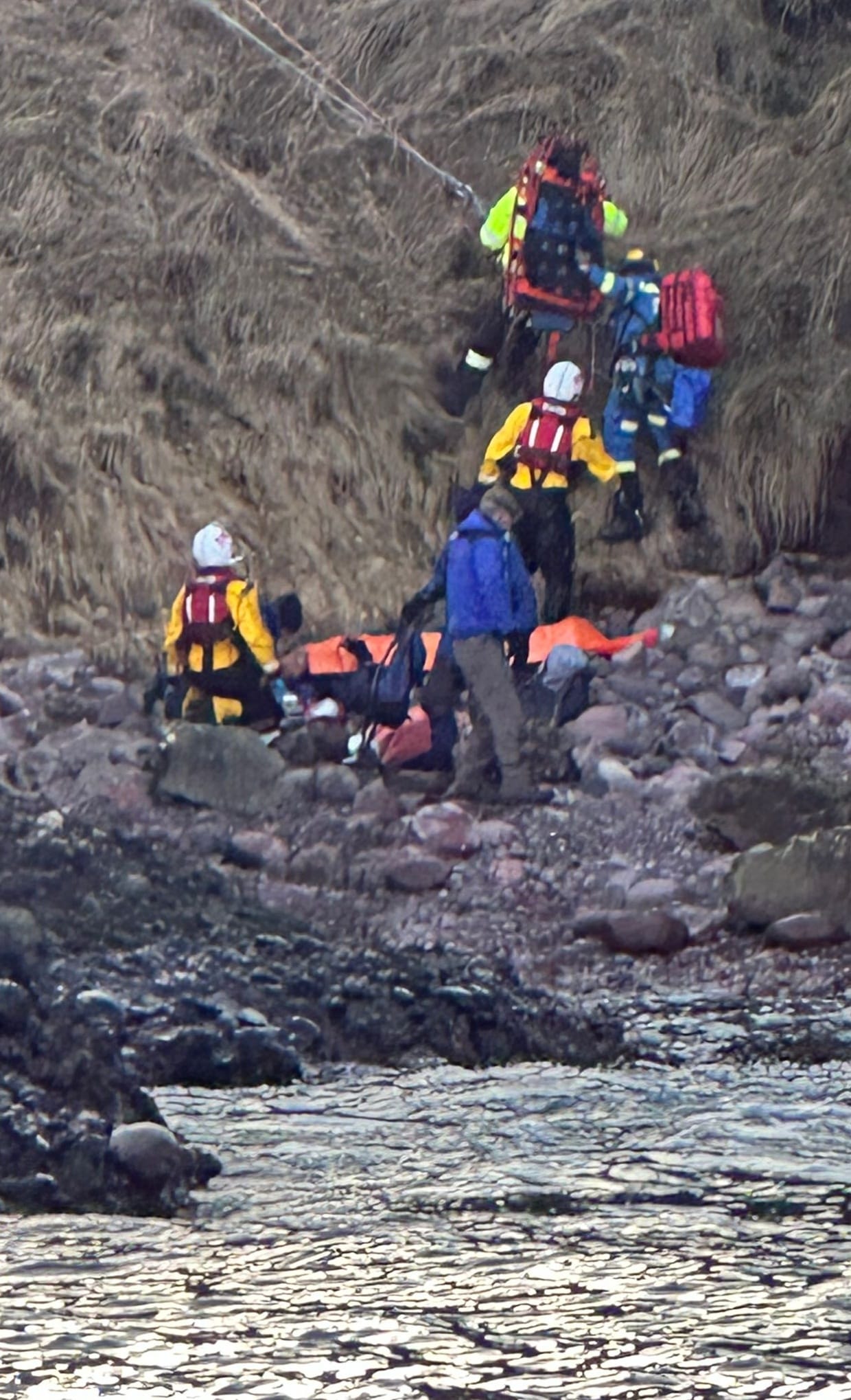 RNLI and Coastguard rescue teams at the scene.