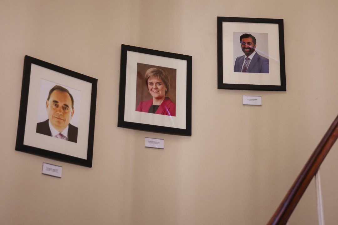 The portraits of first ministers of Scotland, left to right, Alex Salmond, Nicola Sturgeon and Humza Yousaf hanging on the wall at Bute House in Edinburgh
