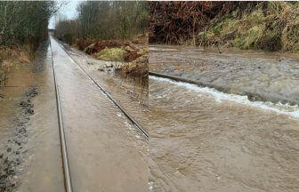 Major rail line in the Highlands closed due to flooding and travel disrupted as heavy rain hits Scotland