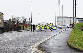 Armed police lock down Ayrshire street amid murder investigation