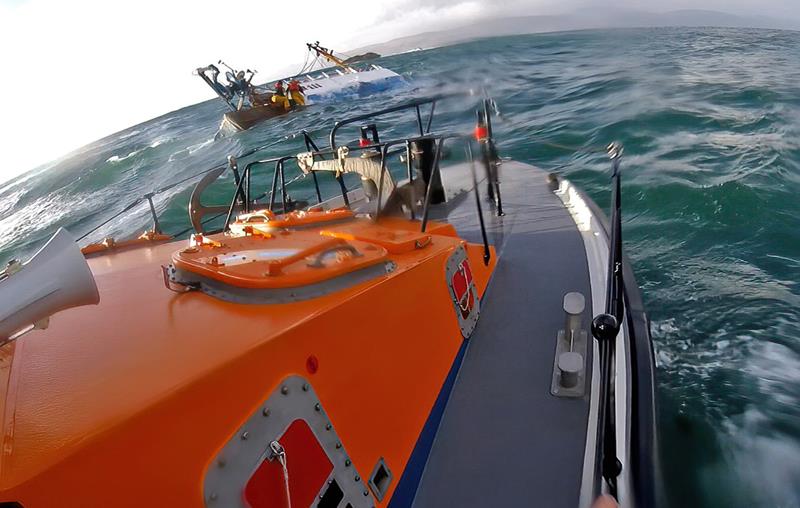 The lifeboat reaches the fishing boat soon after it had begun to list heavily