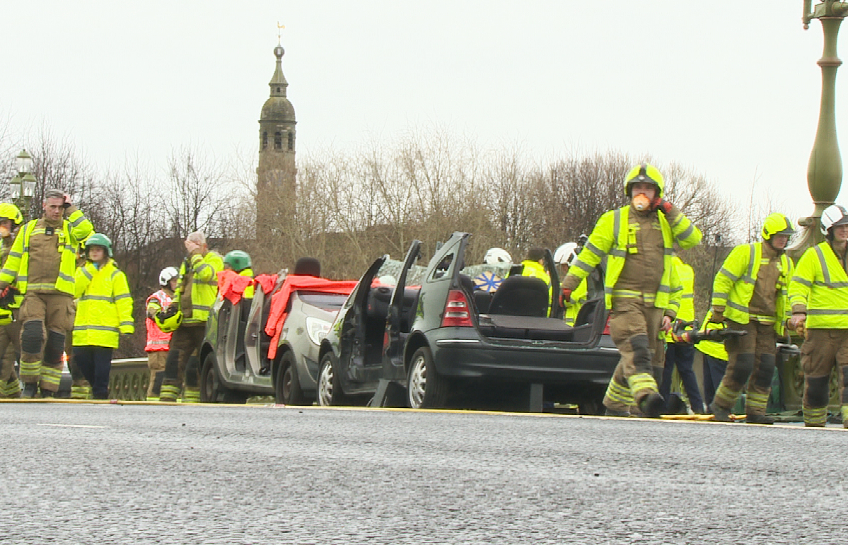 'Live casualties' were sawn out of cars on Albert Bridge during the training simulation in Glasgow.
