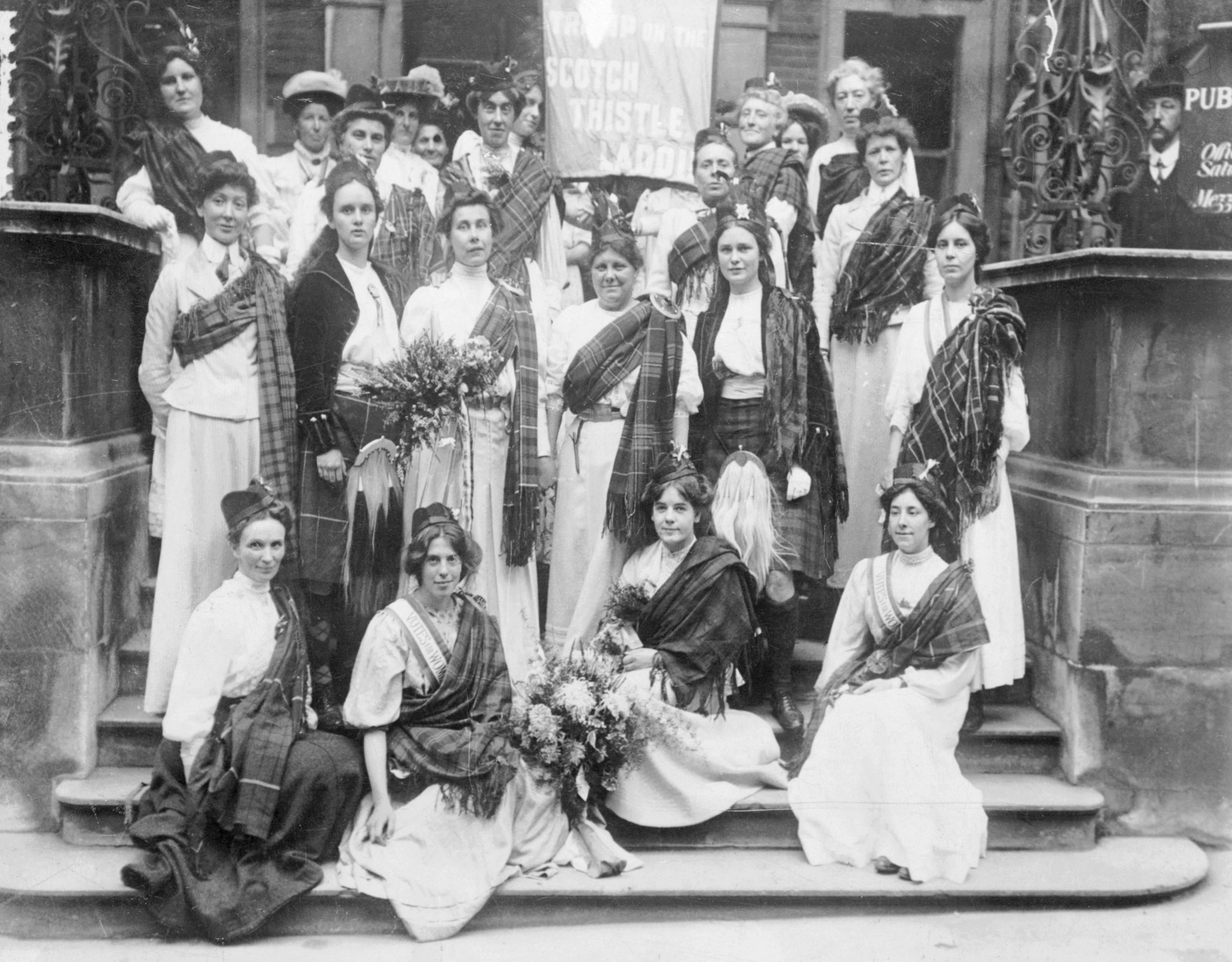 Scottish suffragettes welcoming Mary Phillips (standing third from left) on her release from Holloway Gaol, August 23 1908. Mary Phillips had been sent to prison for obstructing the police in Parliament Square on June 30. 'General' Drummond stands next to her in the centre of the photograph. (Photo by Museum of London/Heritage Images/Getty Images)