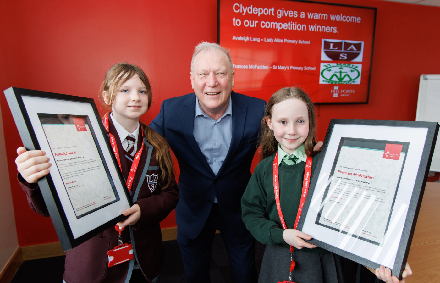 Port director Jim McSporran pictured with competition winners Avaleigh Lang, left, and Frances McFadden, right.