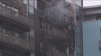 Two firefighters injured after blaze at Edinburgh flats