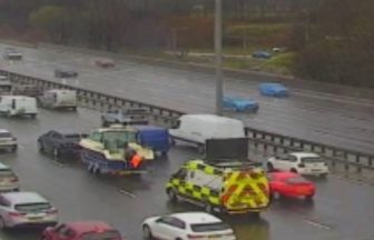 Car towing boat breaks down on M8 causing traffic disruption