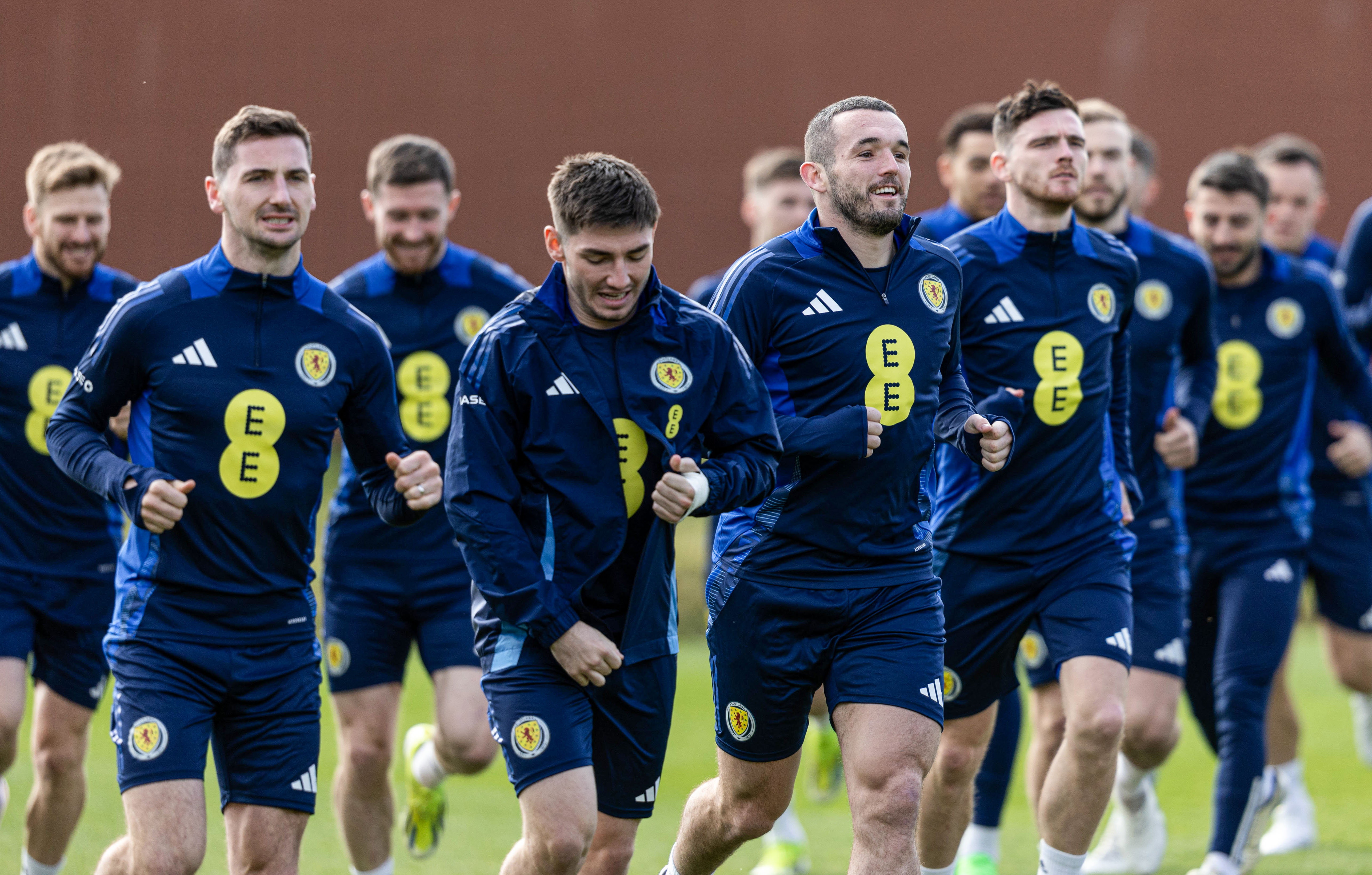  John McGinn leads the squad in warming up during a Scotland training session at Lesser Hampden.  (Photo by Craig Foy / SNS Group)