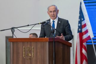 Cracks widen in Israel cabinet as top Netanyahu rival heads to US talks