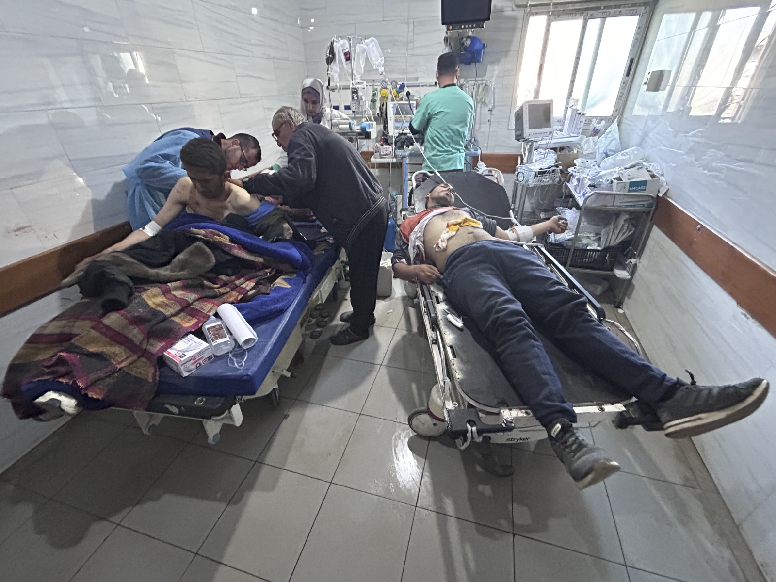 Palestinians injured in an Israeli strike are treated in Shifa Hospital in Gaza City.