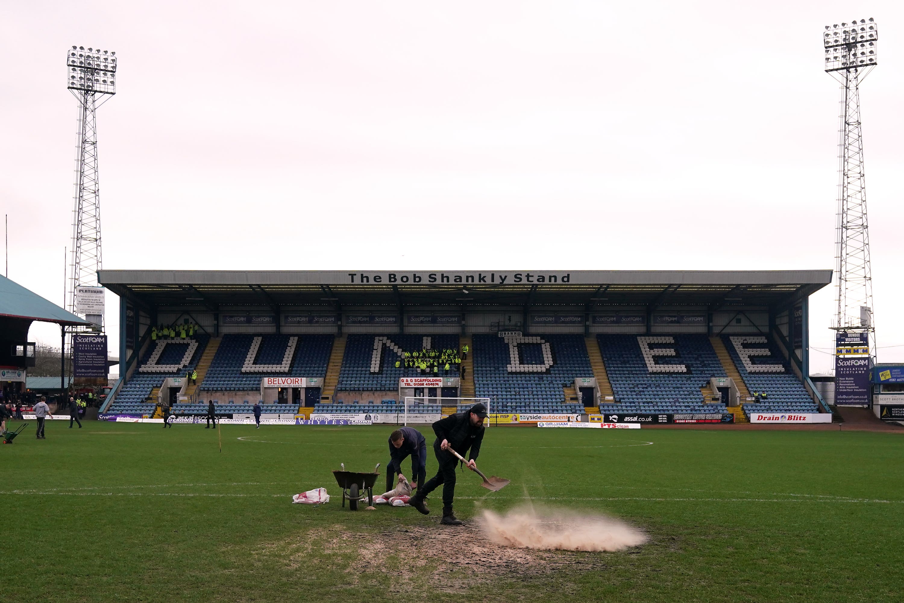 Ground staff work on the pitch before the inspection (Andrew Milligan/PA)