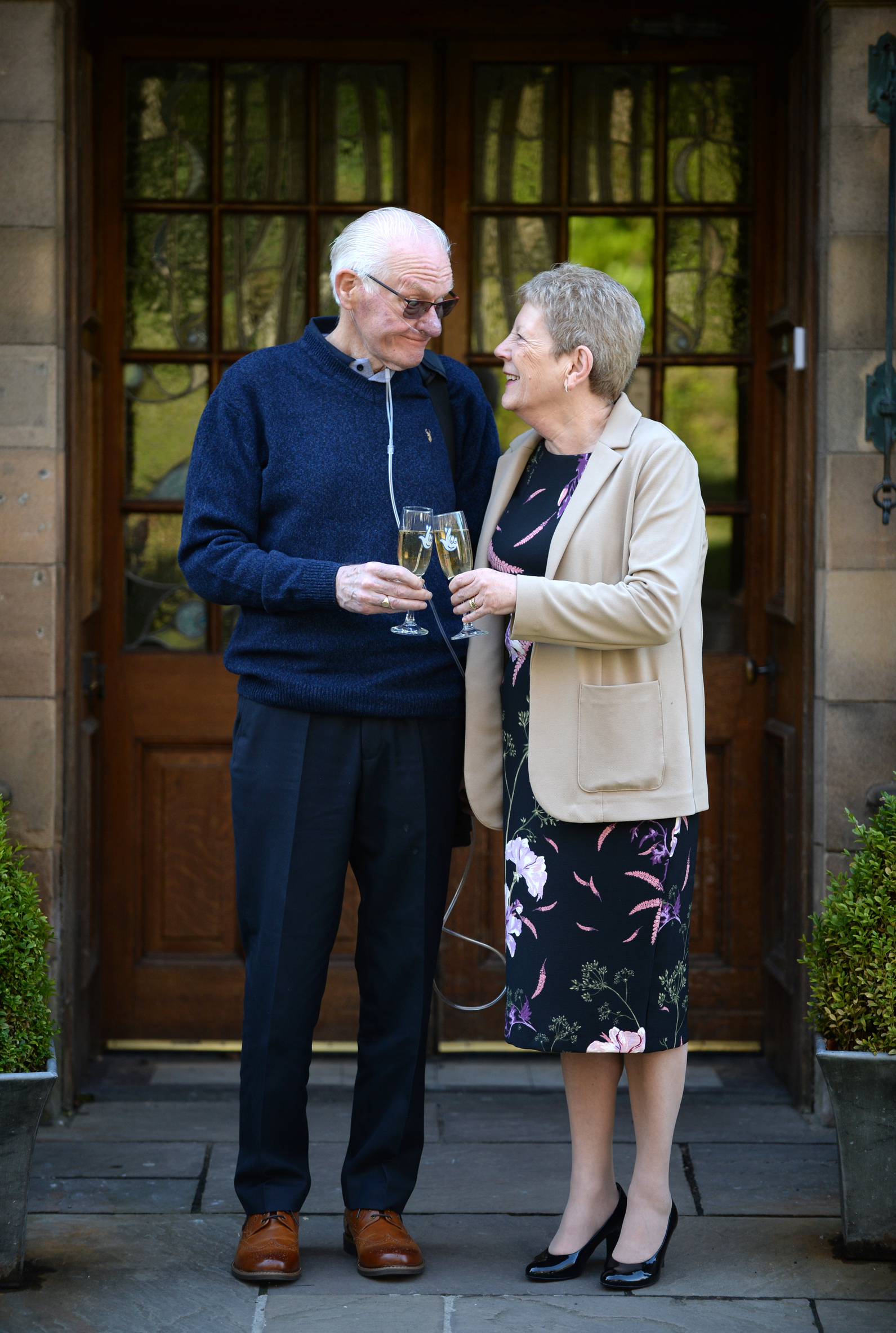 Ian and Marlyn Anderson toast their £1 million EuroMillions win.