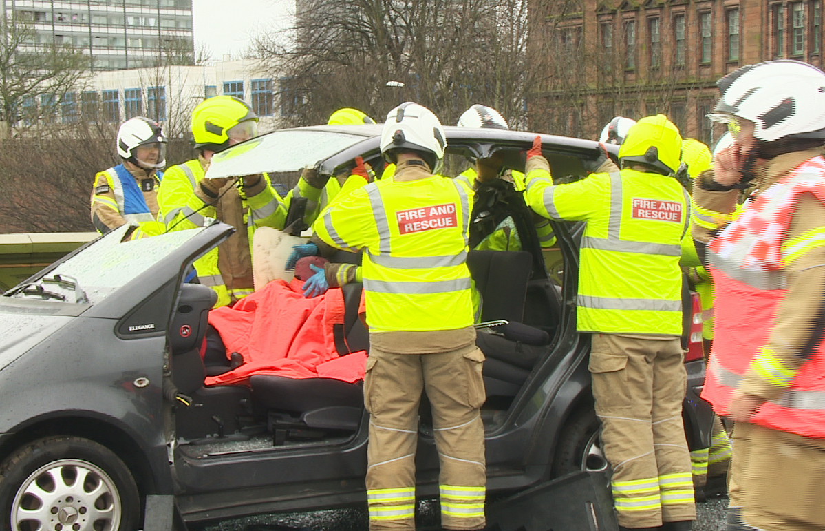 'Live casualties' were sawn out of cars on Albert Bridge during the training simulation in Glasgow.