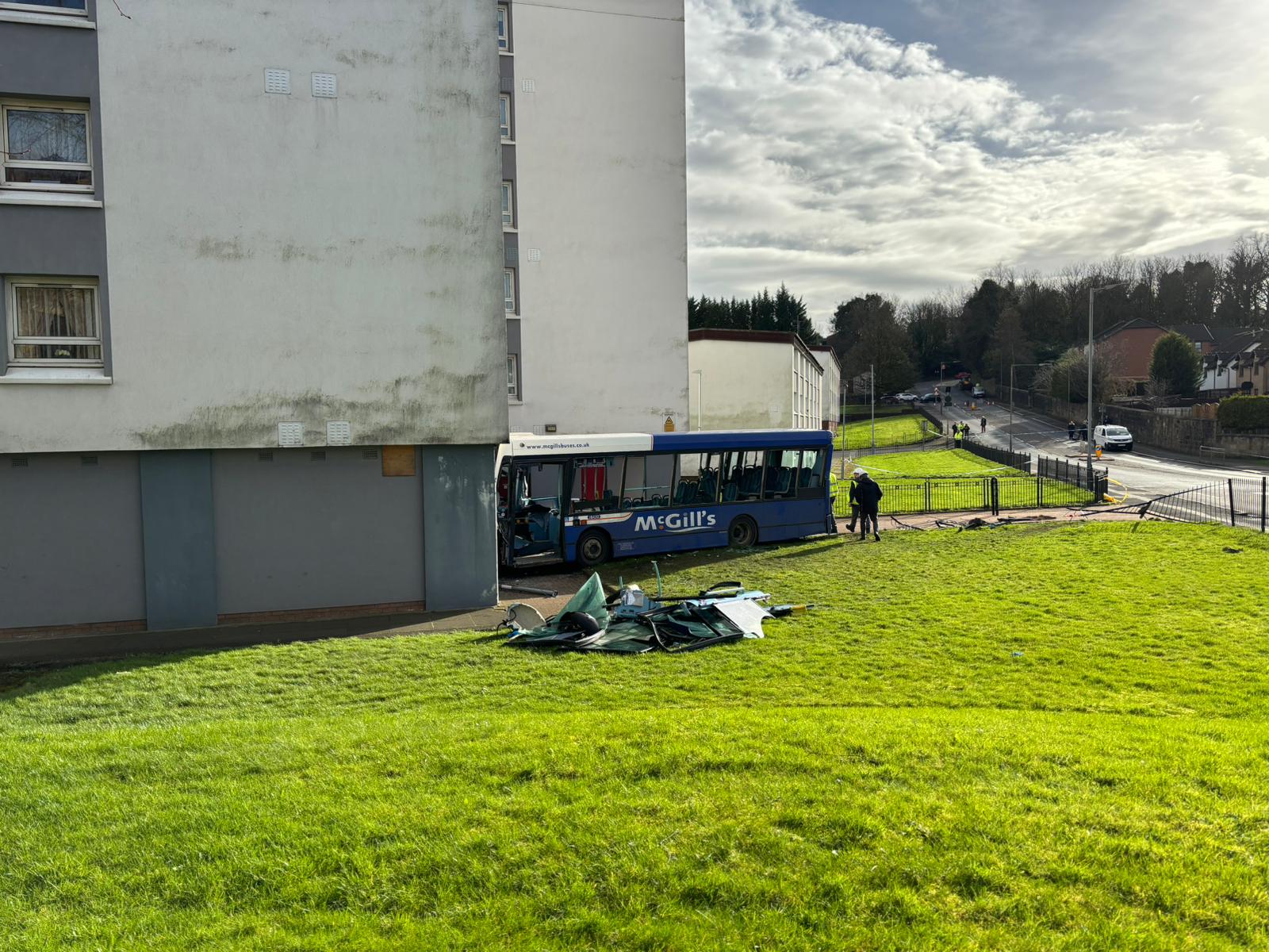 A single-decker McGill's bus has collided with the ground floor of a tower block in Paisley.