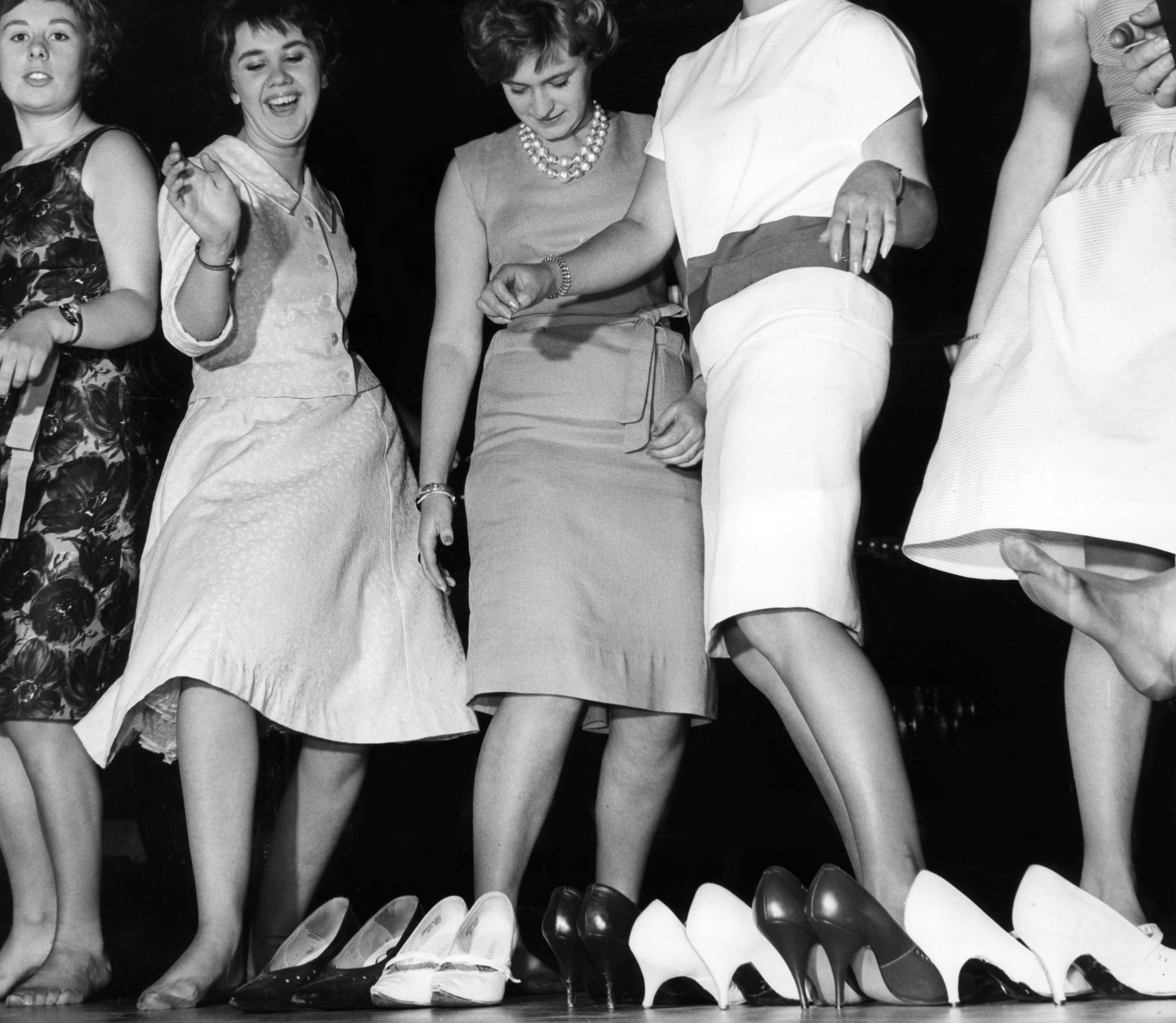 High heels discarded as the girls join in the high jinks at the Locarno nightclub in Glasgow. September 27 1962. (Photo by Staff/Mirrorpix/Getty Images)