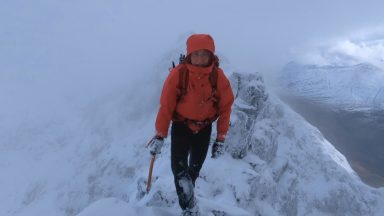 Climber celebrating being first women to climb all munros in winter