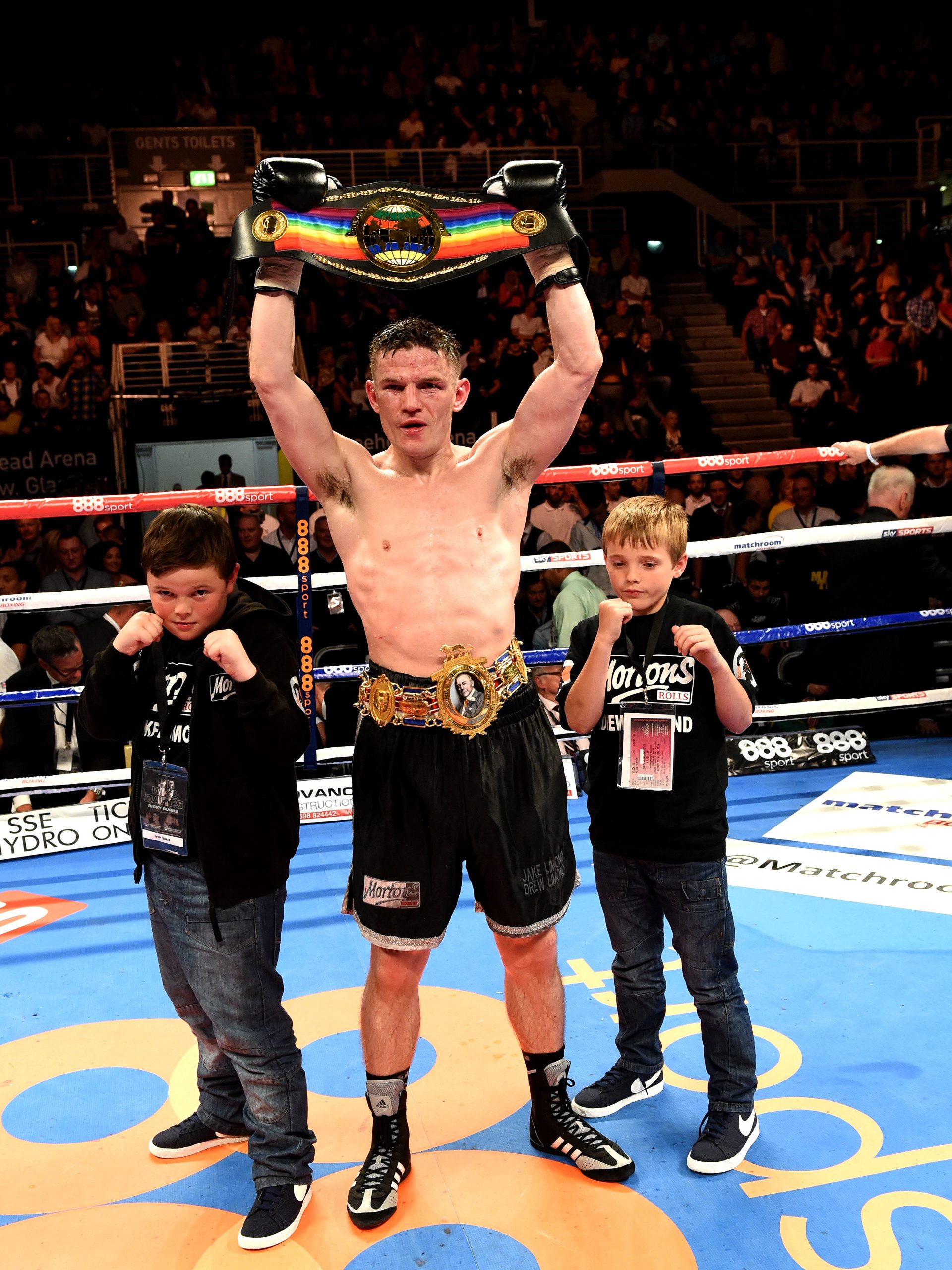 Willie Limond celebrates with sons after winning the Commonwealth and British Light Welterweight title in 2014.