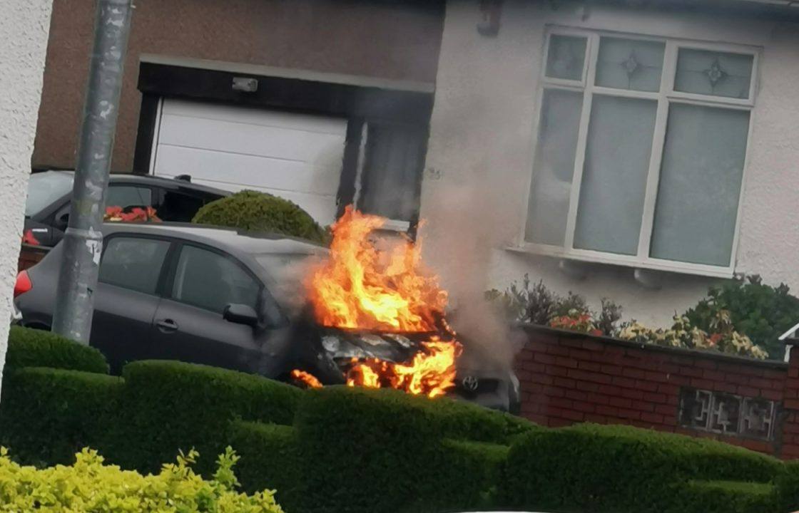 Firefighters called to Glasgow street after car catches fire
