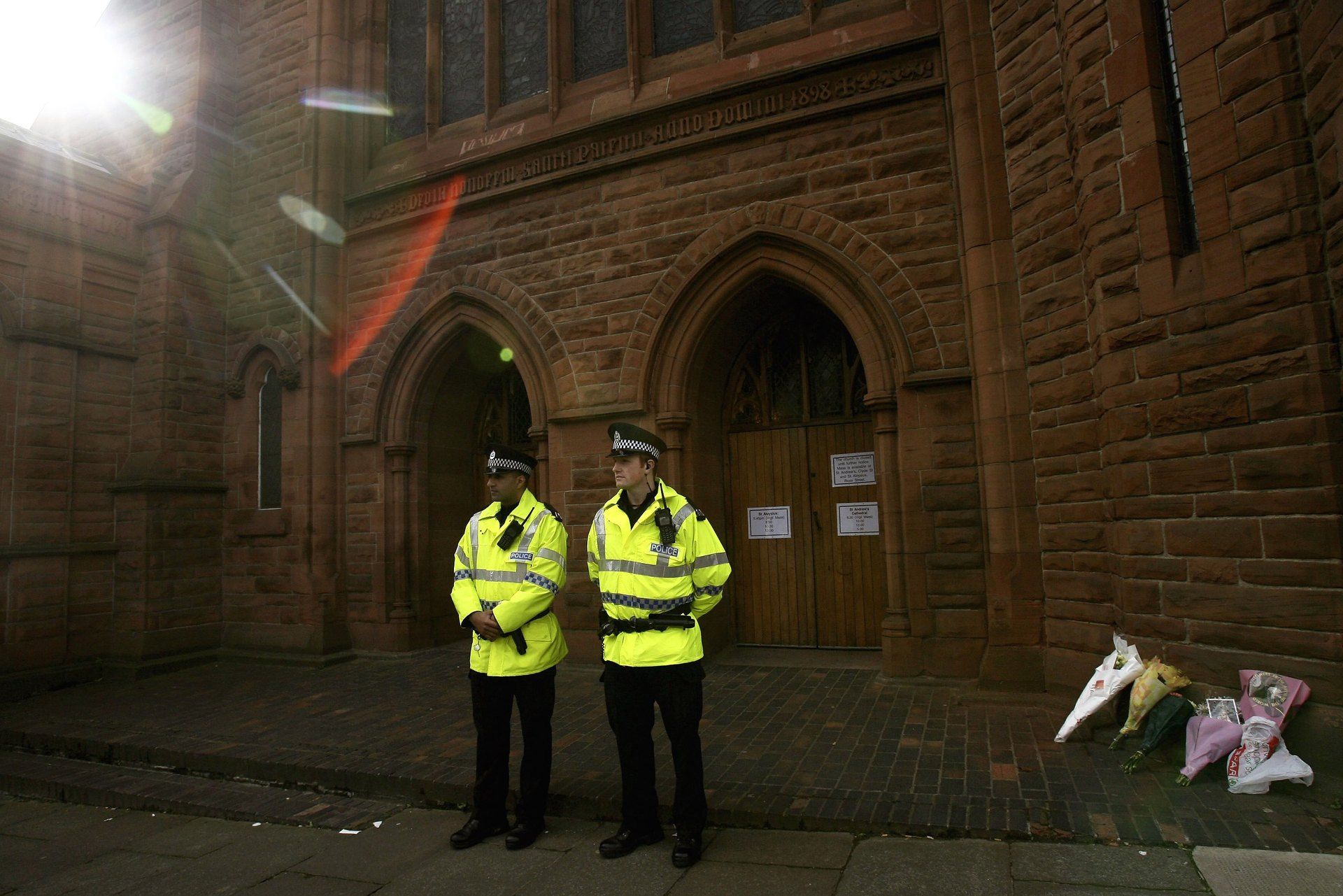 Police stand outside St Patricks Church in Glasgow where Angelika Kluk's body was found September 30, 2006.