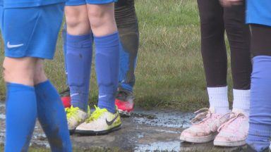 Parents and children call for investment in waterlogged pitch