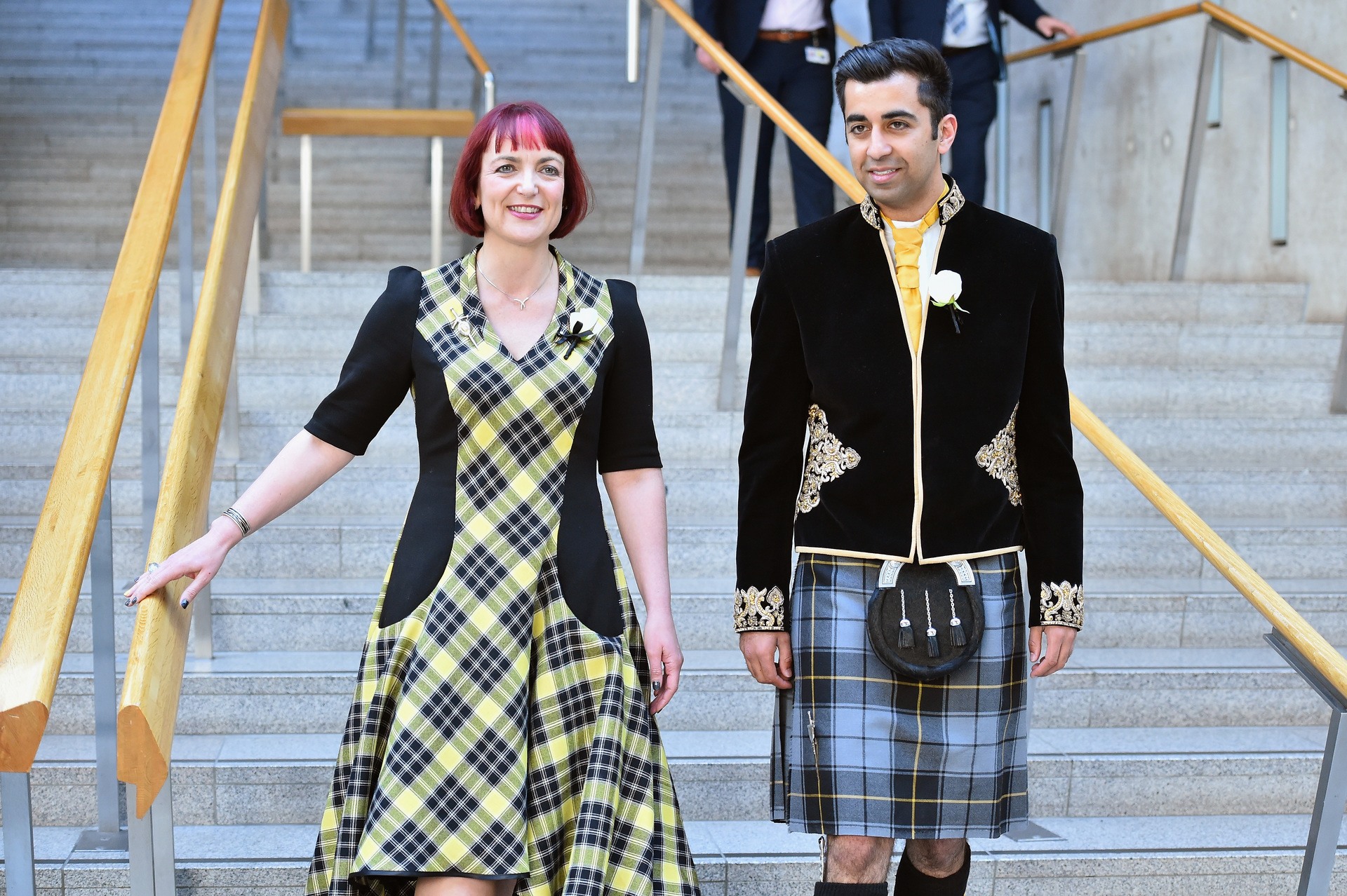 Angela Constance and Humza Yousaf of the SNP walk down the garden lobby steps after being sworn in at the Scottish Parliament for the fifth session of the Scottish Parliament on May 12, 2016.