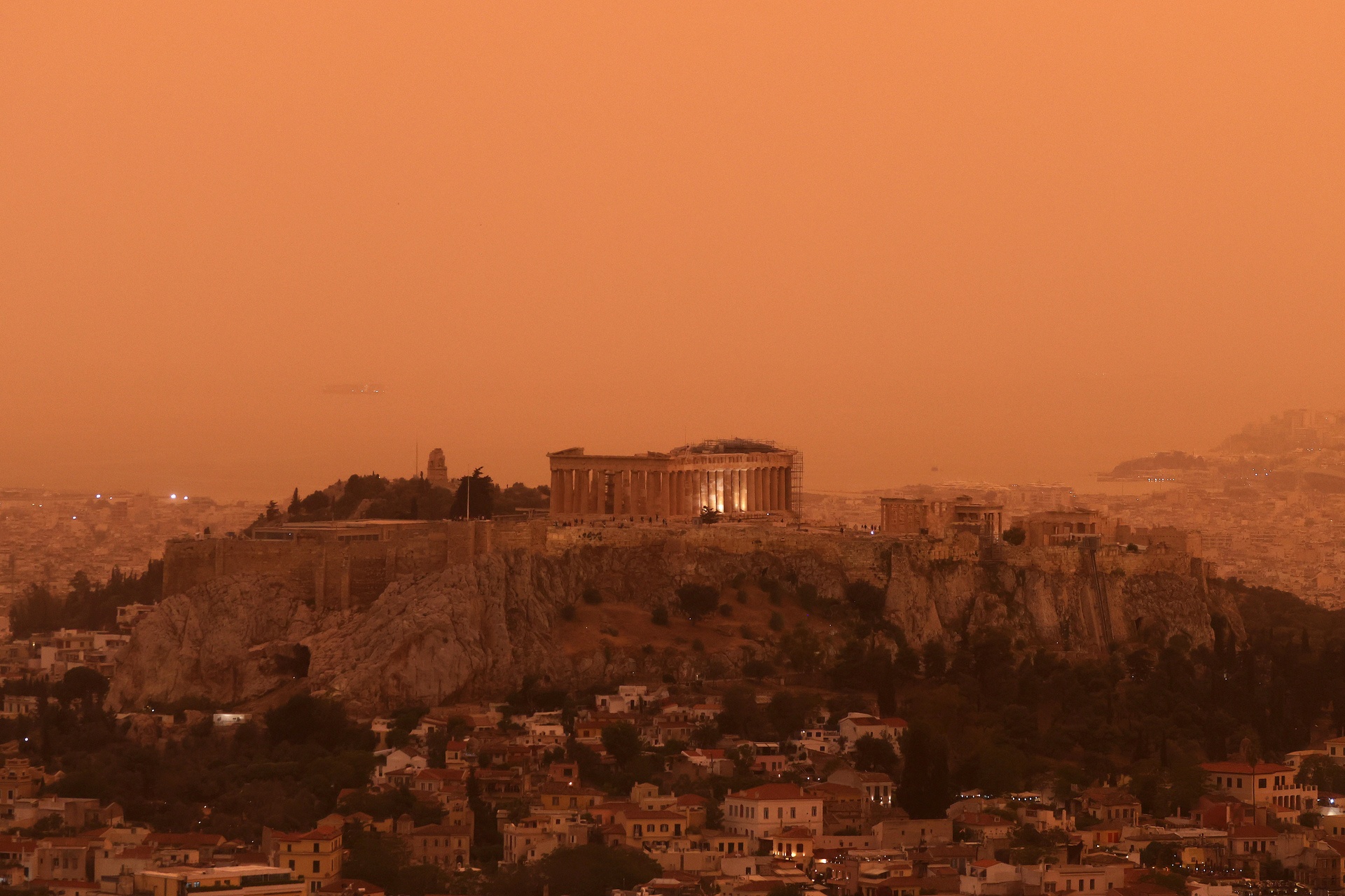 ATHENS, GREECE - APRIL 23: Dust from the desert of Sahara covers the city in orange haze in Athens, Greece on April 23, 2024. (Photo by Costas Baltas/Anadolu via Getty Images)
