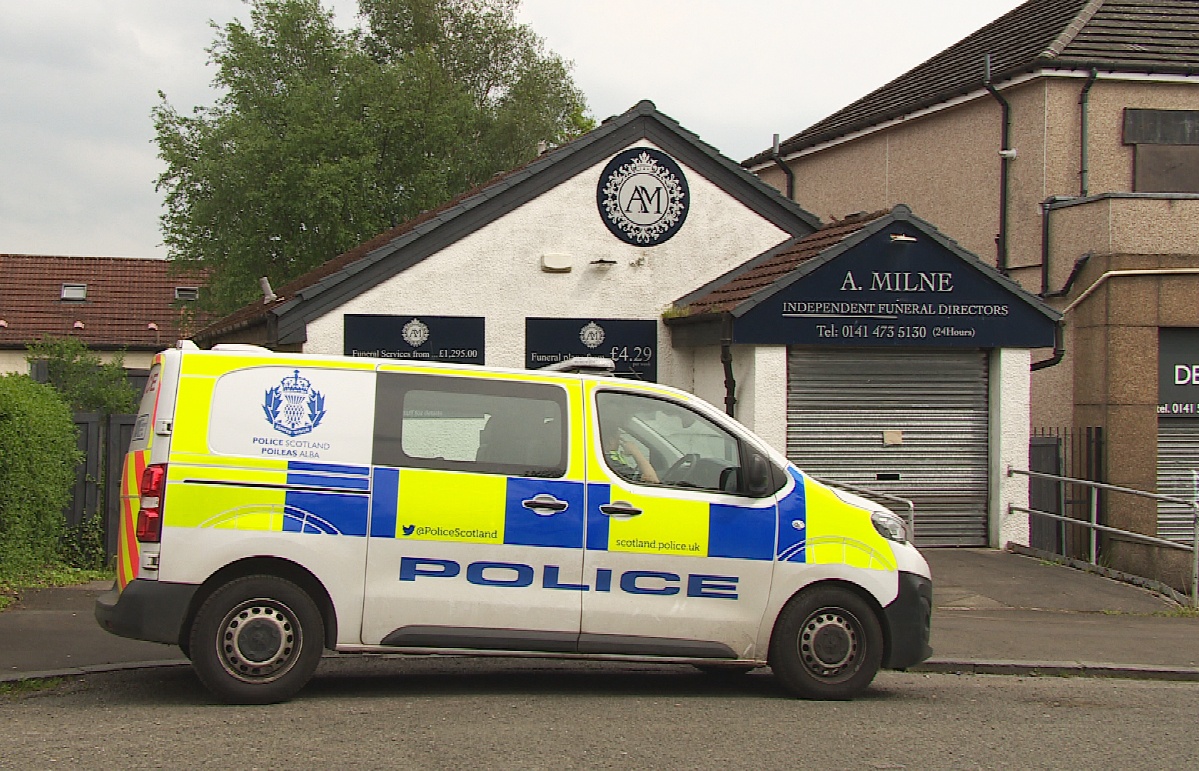 Forensics officers were seen going into a branch of A Milne Funeral Directors in Springburn, Glasgow, after several families reported allegations of ashes going missing, and financial misconduct.
