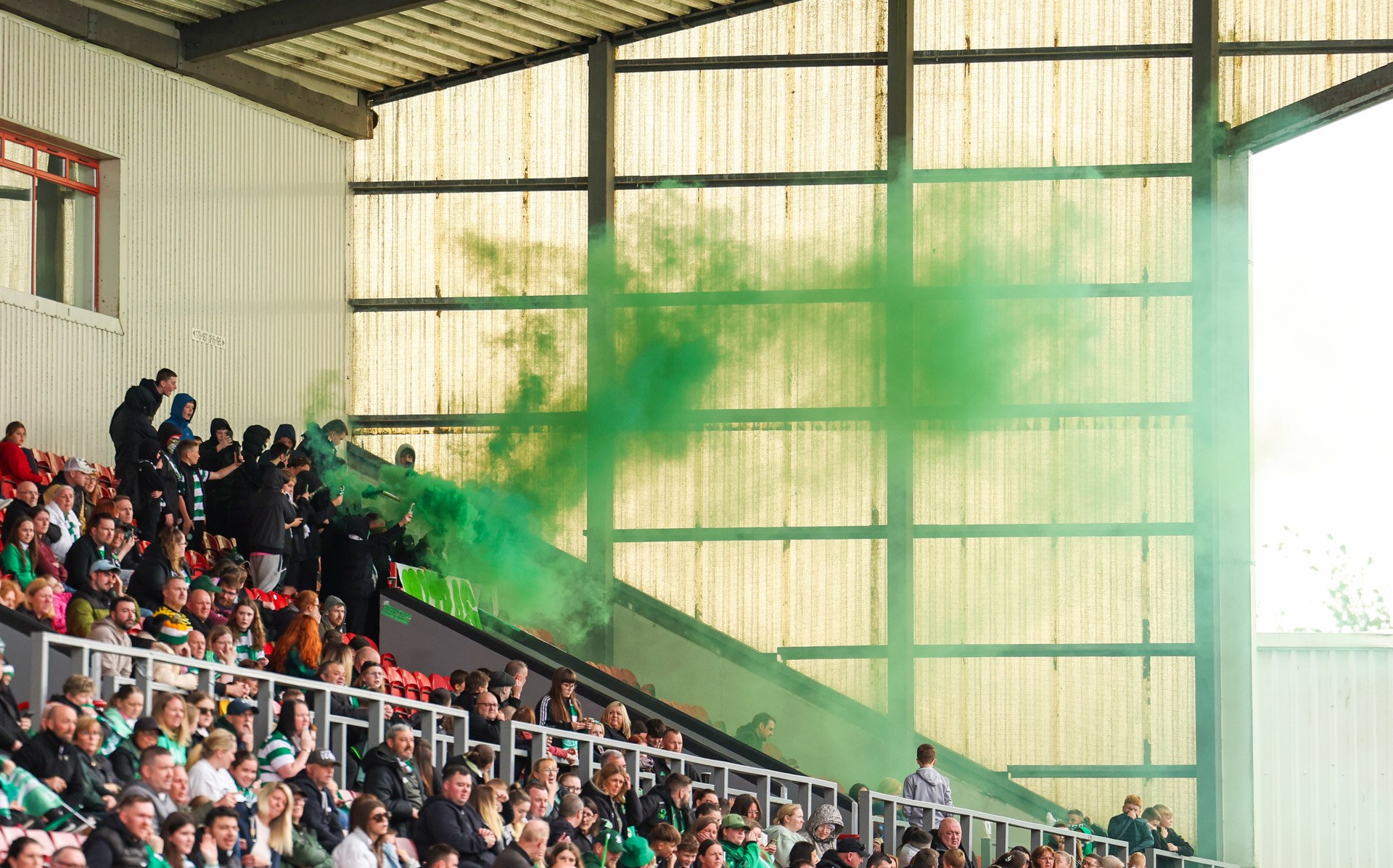 Celtic fans set off pyro in the away end during the match at Broadwood. (Photo by Ross MacDonald / SNS Group)