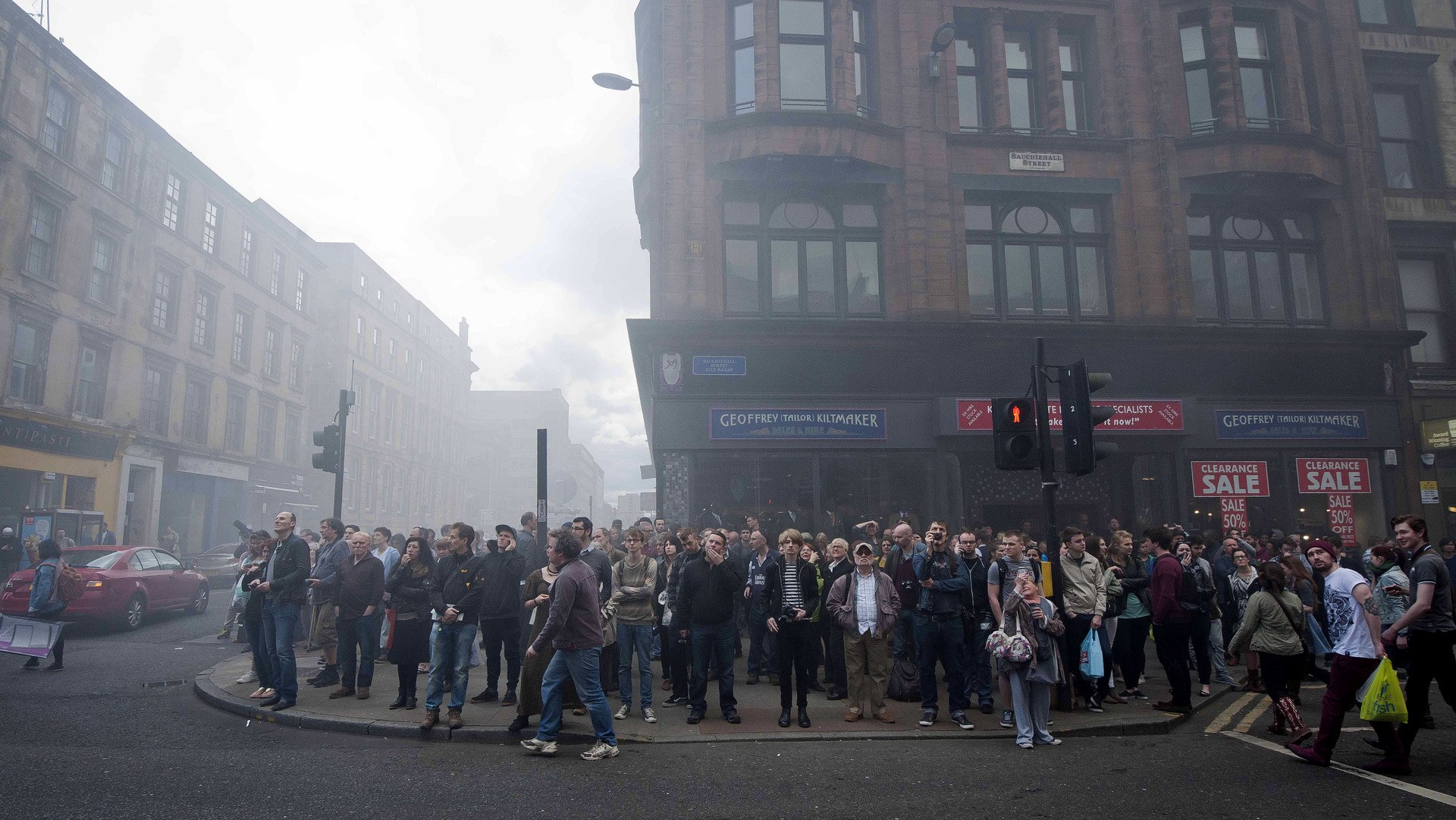 GLASGOW, SCOTLAND - MAY 23:  Students and members of the public react as a fire engulfs the Glasgow School of Art Charles Rennie Mackintosh Building on May 23, 2014