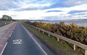 Man and woman left in hospital after crash involving jaguar at junction