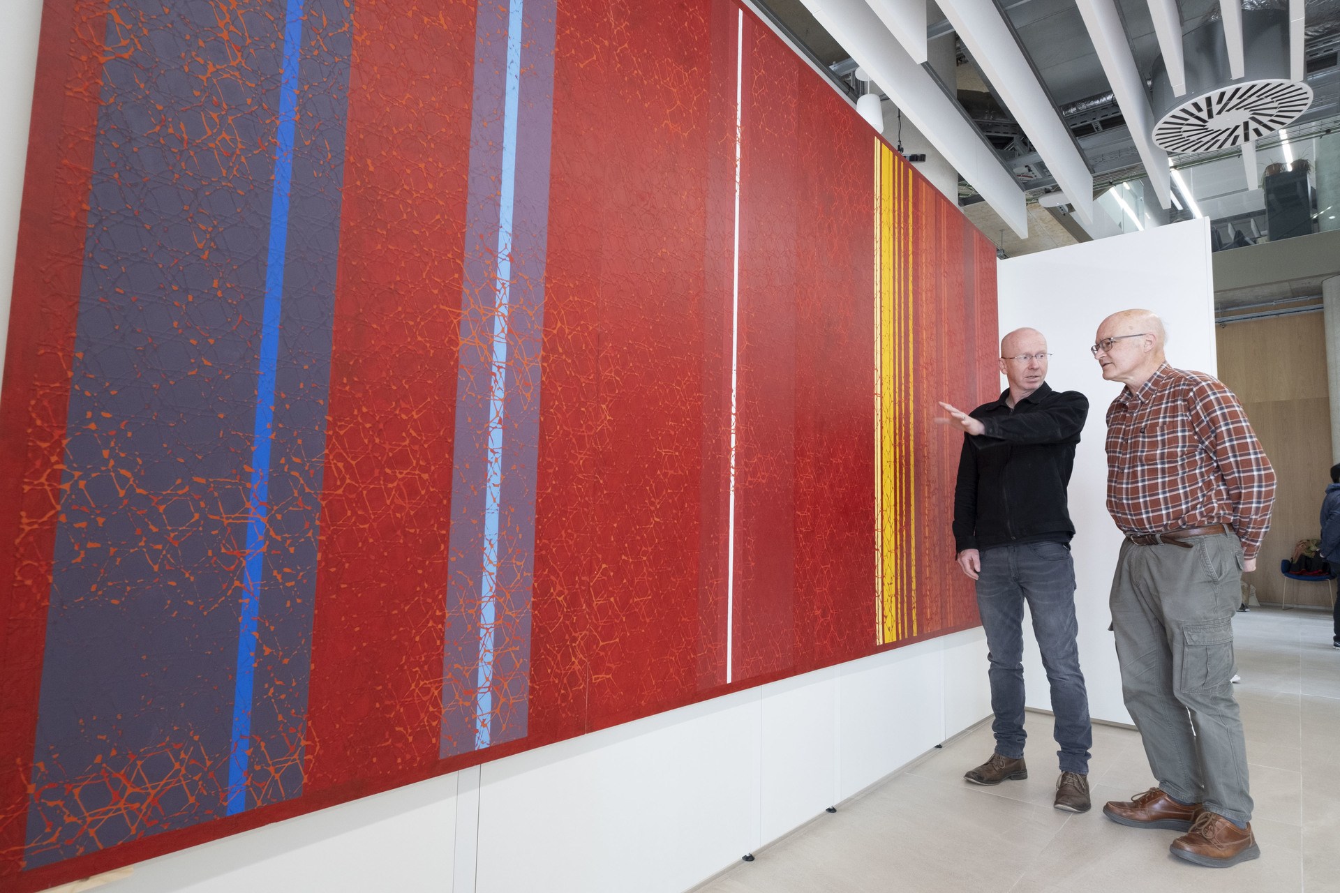 Artist Gregor Harvie discusses his Kelvin-Inspired artwork with Professor Stephen Barnett (centre) of the University of Glasgow's School of Physics & Astronomy