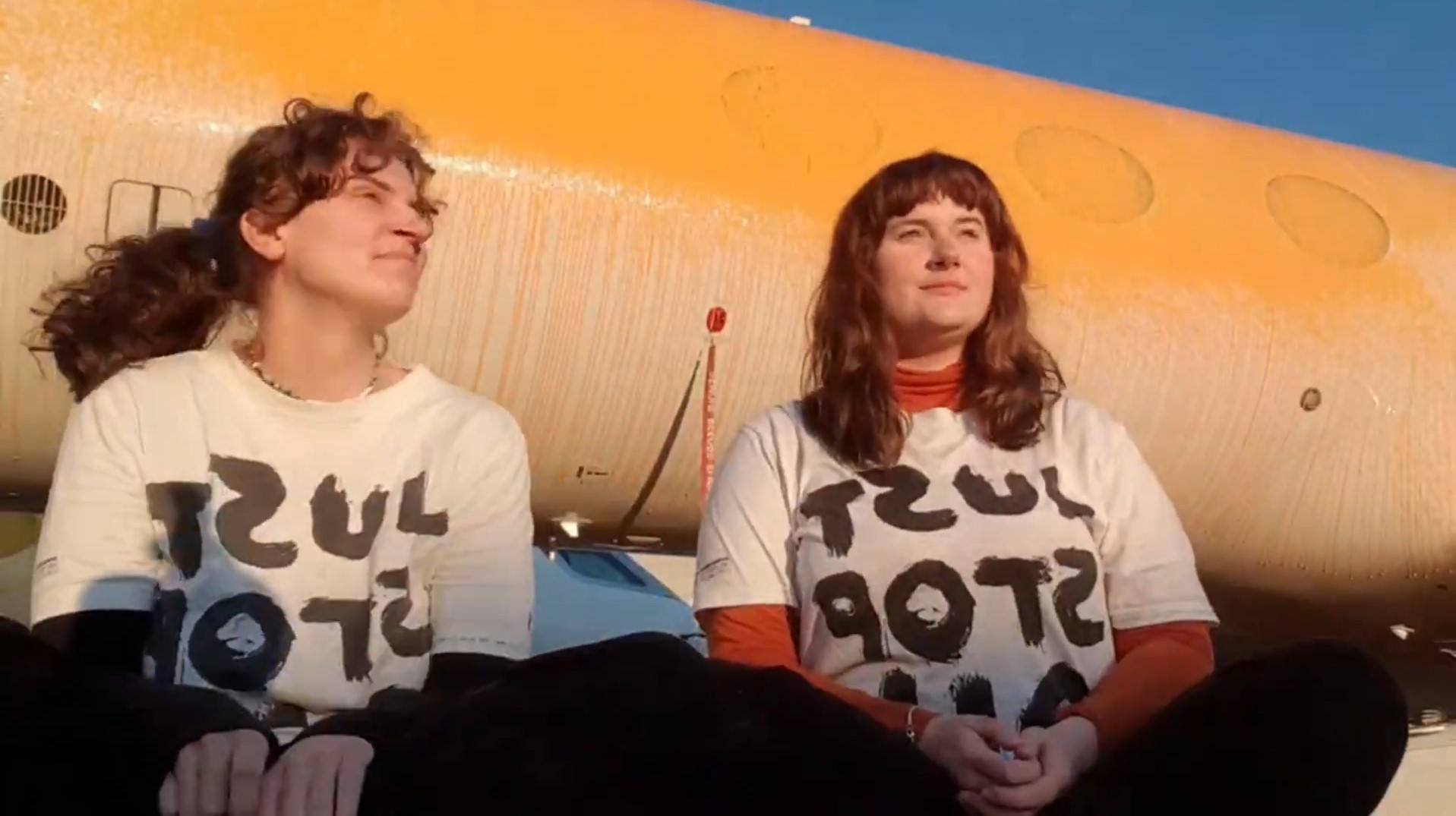 Screen grab taken from handout video of Just Stop Oil protesters Jennifer Kowalski (left), 28, a former sustainability manager from Dumbarton, and Cole Macdonald, 22, from Brighton, after they sprayed orange paint over parked private jets at London Stansted Airport in Essex. Picture date: Thursday June 20, 2024.