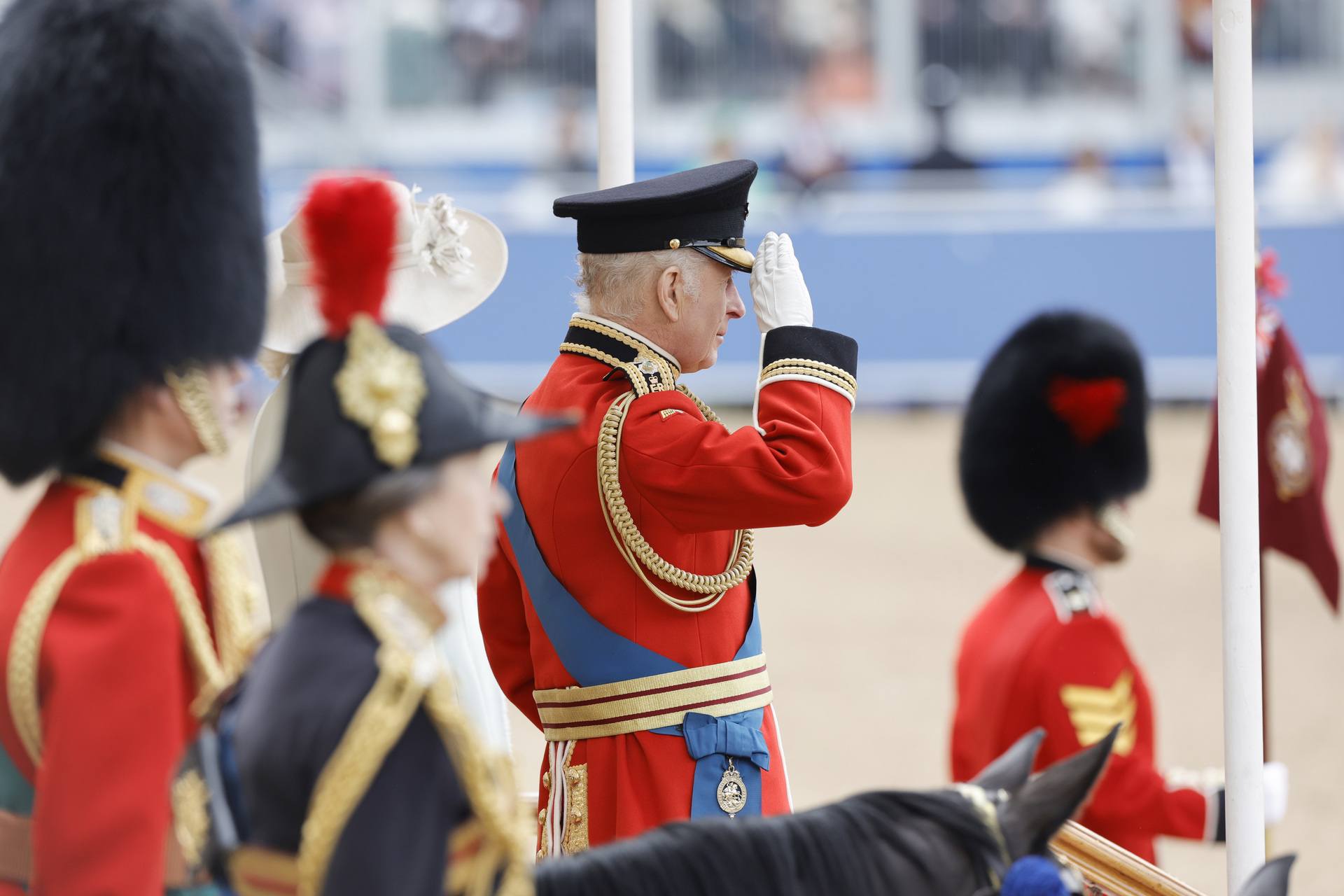 King Charles III during Trooping the Colour at Horse Guards Parade on June 15, 2024 in London, England. Trooping the Colour is a ceremonial parade celebrating the official birthday of the British Monarch. The event features over 1,400 soldiers and officers, accompanied by 200 horses. More than 400 musicians from ten different bands and Corps of Drums march and perform in perfect harmony. (Photo by John Phillips/Getty Images)